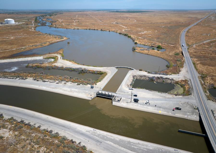 Image shows water from the Kern River flowing into the California Aqueduct via an intertie that can be used in years of high runoff.