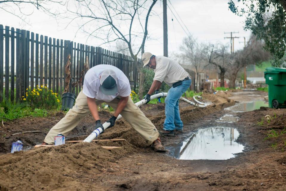 Installing a water line in East Porterville, Calif.