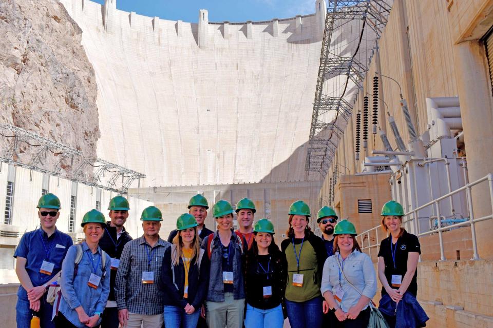 Colorado River Water Leaders pose at the base of Hoover Dam on the Colorado River. 