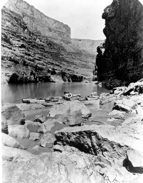 Boats of Powell's second expedition down the Colorado River in Marble Canyon. Note the armchair and life preservers.