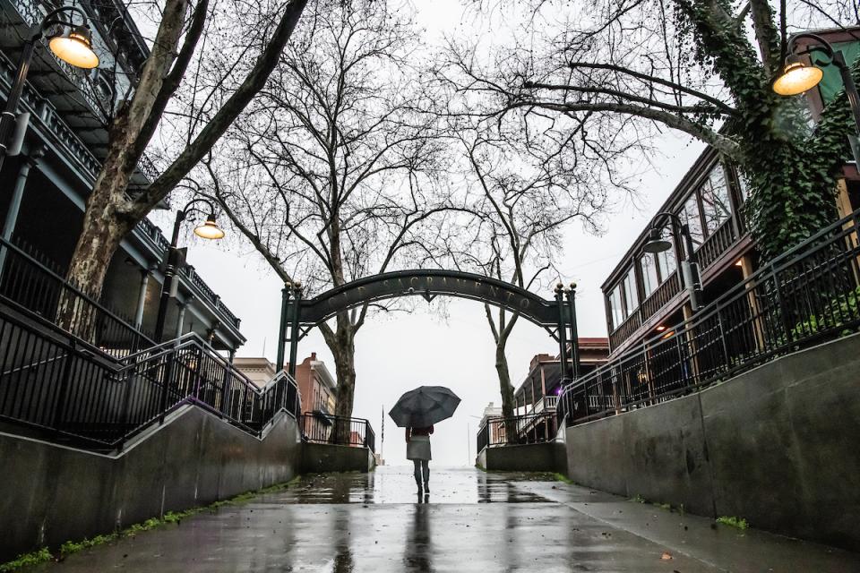 Pedestrian walking in the rain. 