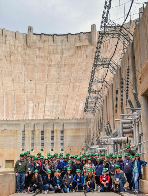 Tour participants gathered for a group photo in front of Hoover Dam