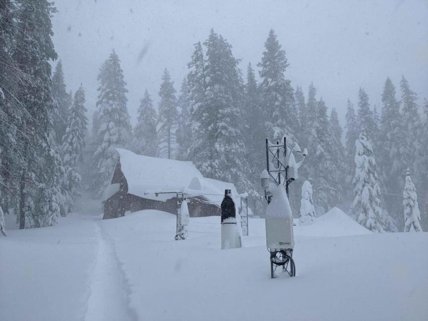 Image of the lab and its instruments covered in snow.  The lab receives around 400 inches of snow per year on average.