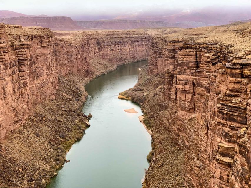 The Colorado River threading its way through a desert canyon near Lee Ferry, Arizona. 