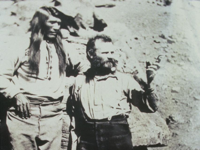 Explorer John Wesley Powell and Paiute Chief Tau-Gu looking over the Virgin River in 1873.