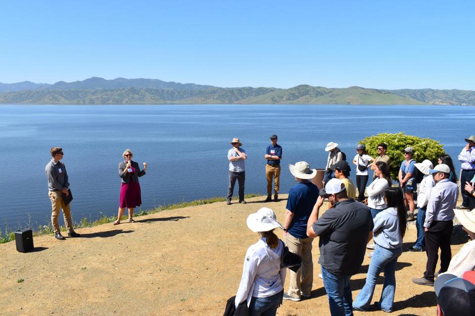 Photo of tour participants looking out across San Luis Reservoir