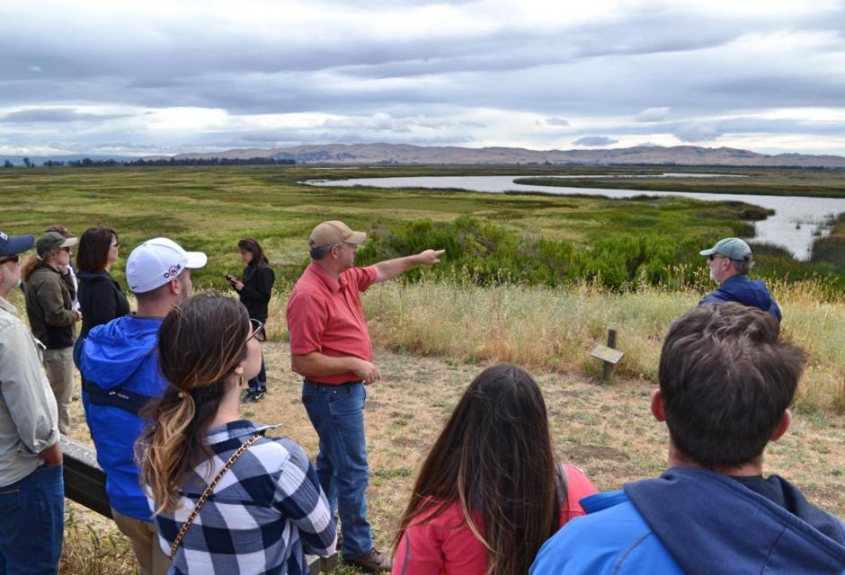 Participants on the Foundation's Bay-Delta Tour listen to a speaker during a stop.