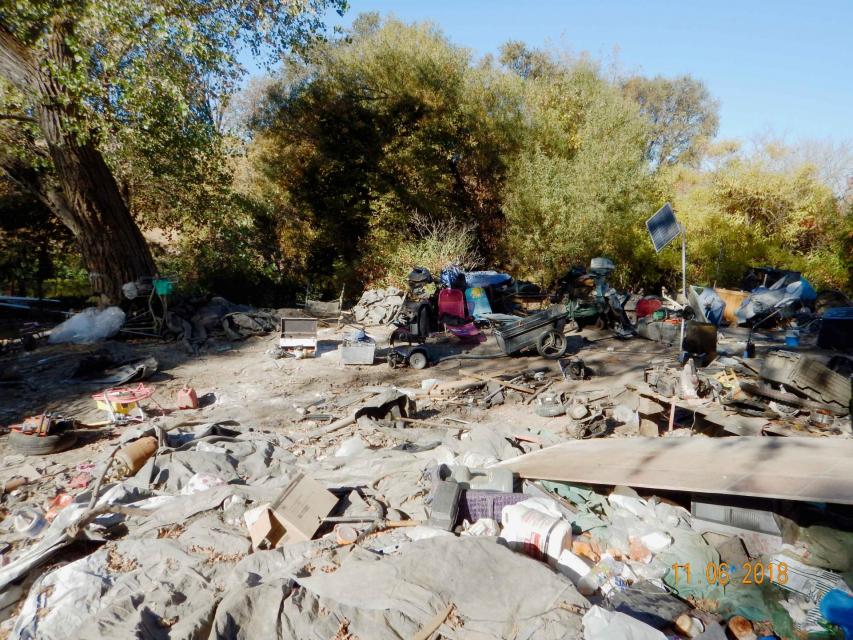 Trash is piled up at a homeless encampment along Sacramento's Steelhead Creek in 2018. Steelhead Creek is used by fall run Chinook salmon and Steelhead trout on their way to Dry Creek to spawn.  An estimated 120,000 pounds of trash were removed.  