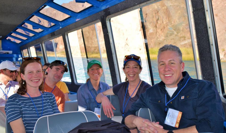 Photo shows participants on our Lower Colorado River Tour as the group takes a boat ride on the Lower Colorado River to explore habitat in Havasu National Wildlife Refuge.