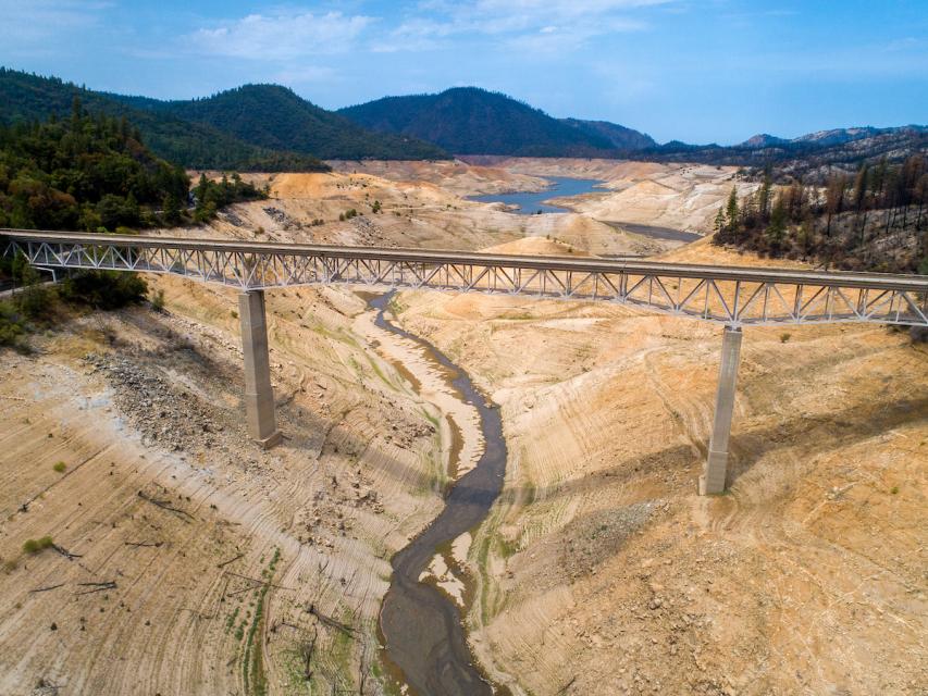 Aerial photo of a portion of Lake Oroville in July 2021 showing almost no water, the result of a two-year drought.