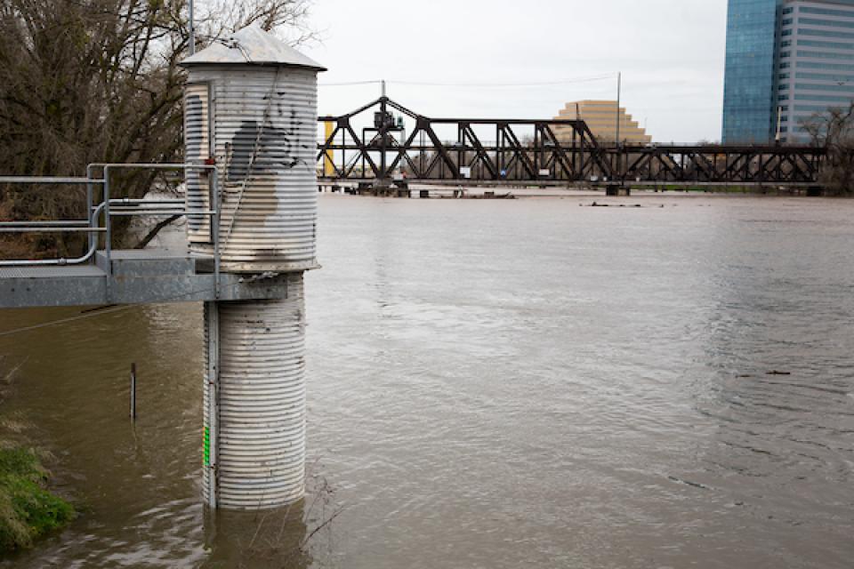 Stream gauges gather important metrics such as  depth, flow (described as cubic feet per second) and temperature.  This gauge near downtown Sacramento measures water depth.