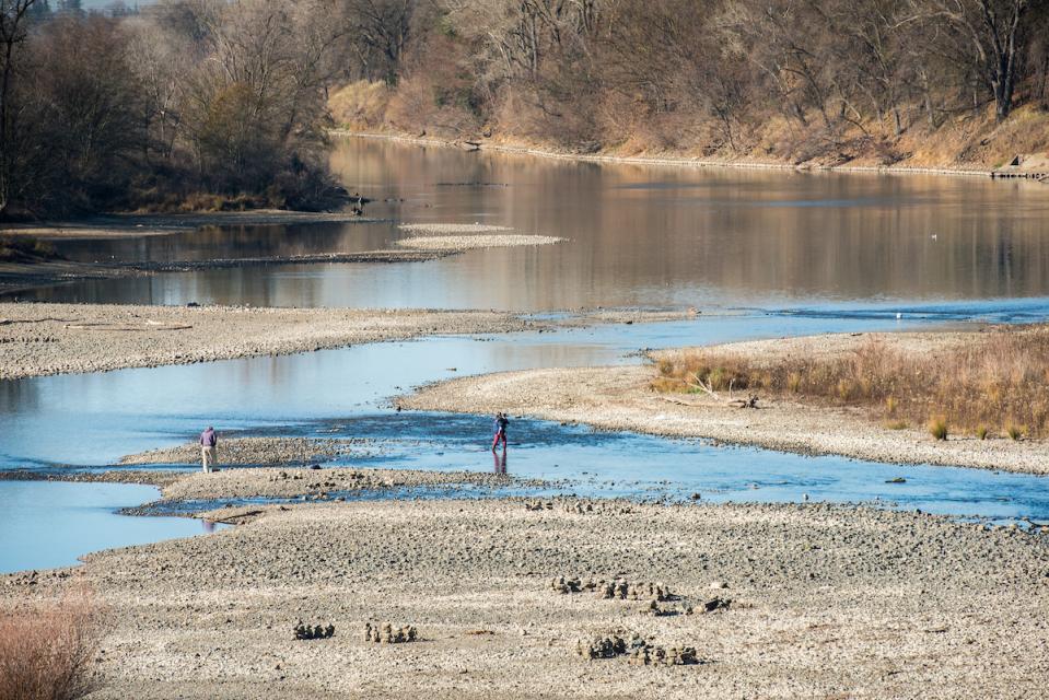 The American River in Sacramento in 2014 shows the effects of the 2012-2016 drought. Climate change is expected to result in more frequent and intense droughts and floods. 