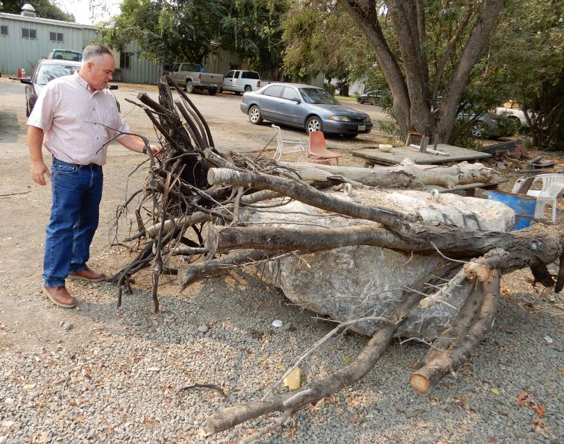 Roger Cornwell, general manager of River Garden Farms, with an example of a salmon refuge, similar to what was placed in the Sacramento River.